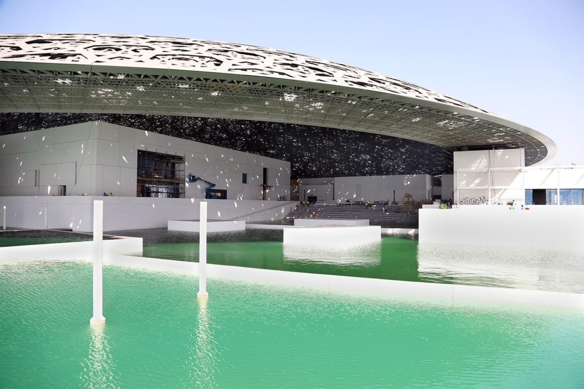 Temporary walls removed to allow the sea to surround the building, realising the architect’s vision for the world-class cultural institution to float on the Arabian Gulf. Courtesy TDIC, Architect: Ateliers Jean Nouvel